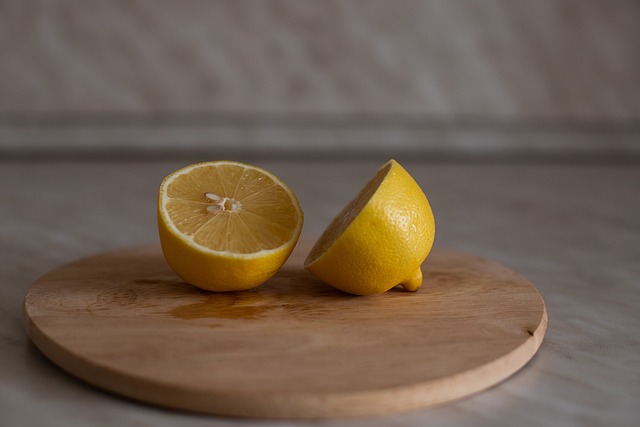 lemon on wooden cutting board 