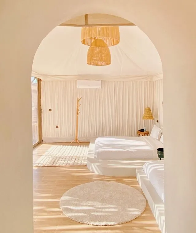 arches shape entrance and dome shapes lighting key elements of Mediterranean Bedroom design
