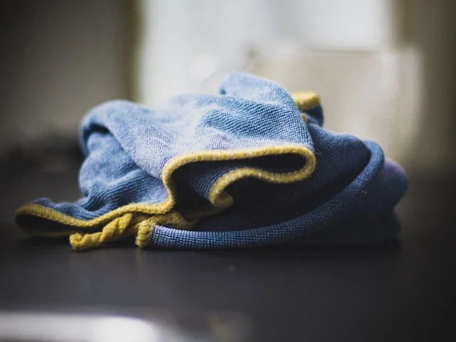 Blue Microfiber Cleaning Cloths on the counter- what professional cleaners use