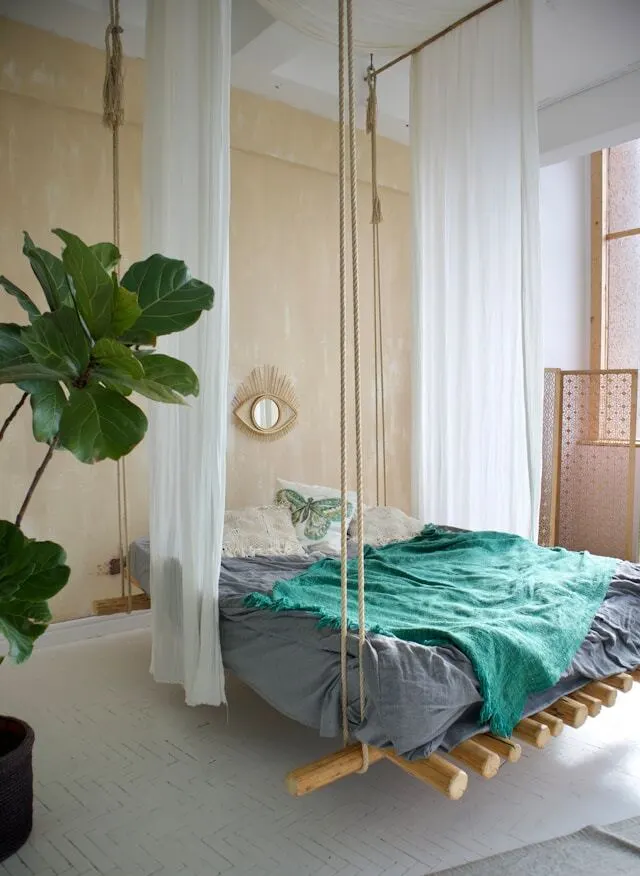 floated DIY woody bed hanging from ceiling