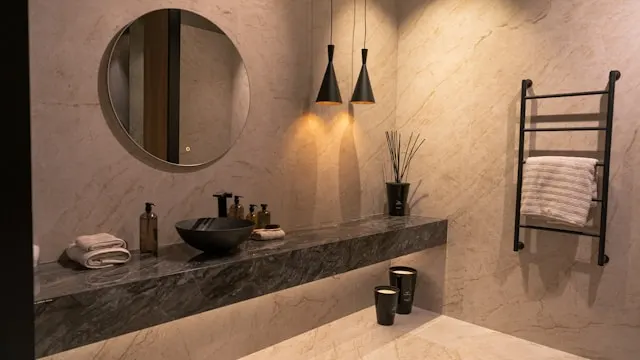 modern bathroom design 2025 with large format marble tiles in black and white theme