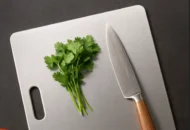 cilantro on stainless steel cutting board